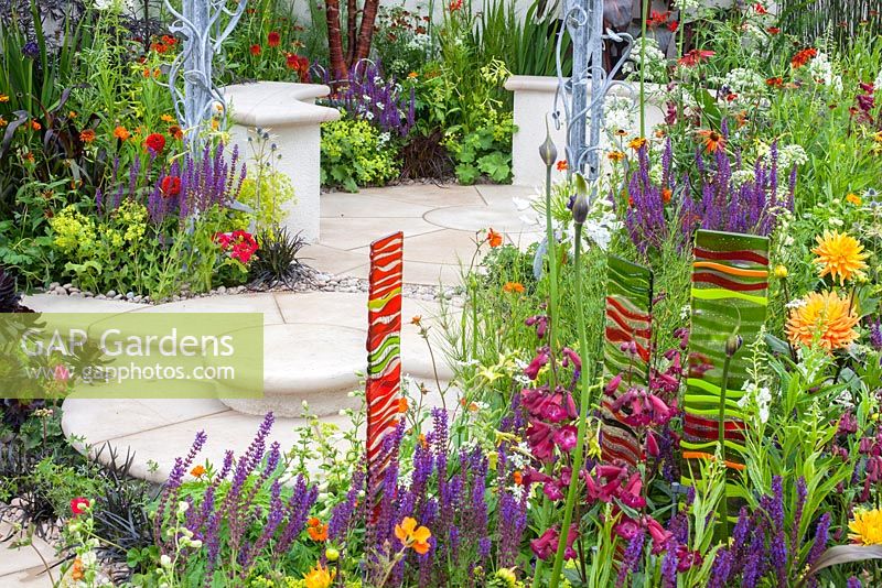 Circular steps amid a profusion of colour in the New Horizons garden at Hampton Court Palace Flower Show 2016