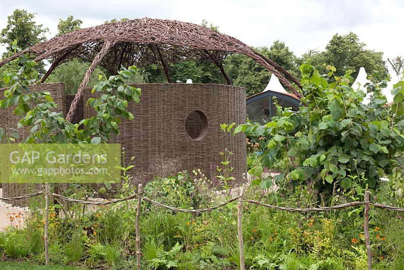 Wicker domed structure in PMS Outside Inside Garden for NAPS at RHS Hampton Court Flower Show 2016
