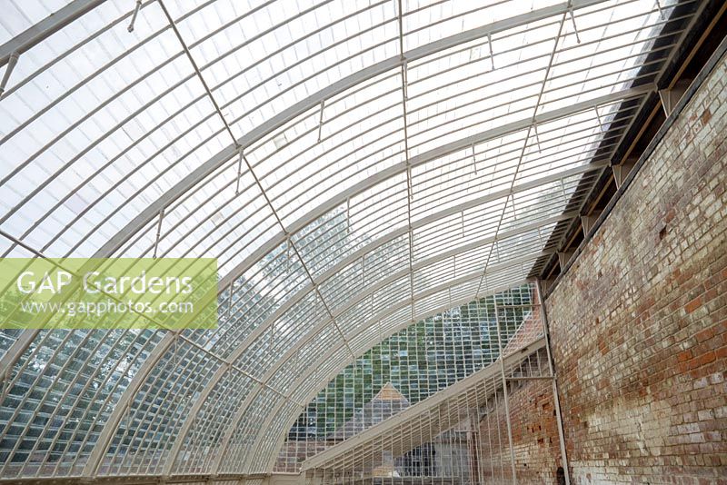 Historic restored greenhouse constructed with postcard sized glass panes.