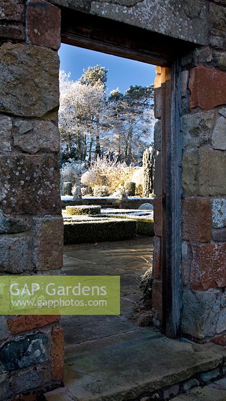 Doorway through walled garden to parterre