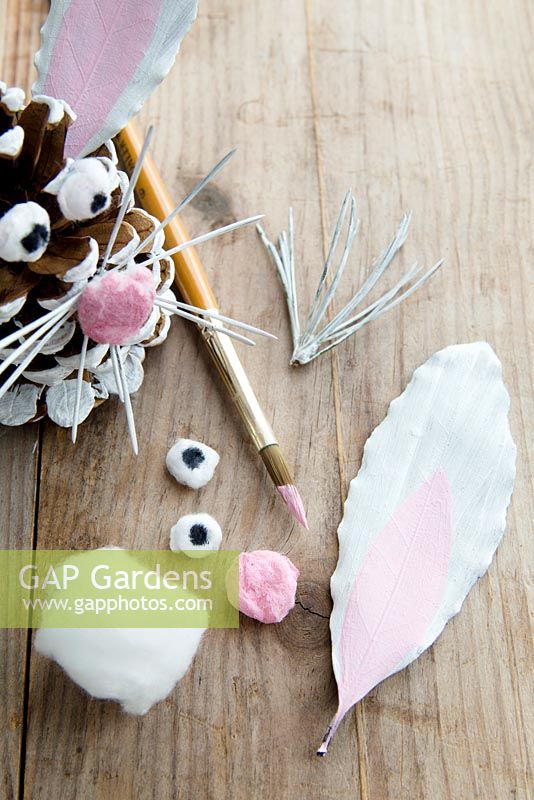 Ingredients needed to make an Easter bunny - pine cones, leaves and fir tree whiskers.