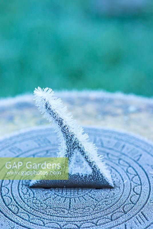 Frost covered garden sundial.