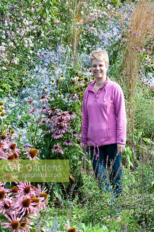 Helen Westendorp in her garden at Hawkley Cottage, Eastcombe, Gloucestershire. The garden is open for the National Garden Scheme