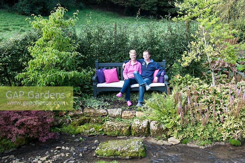 Helen and Gerwin Westendorp in their garden at Hawkley Cottage, Eastcombe, Gloucestershire. The garden is open for the National Garden Scheme
