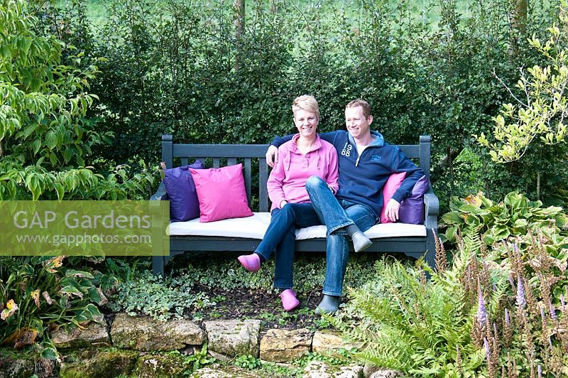 Helen and Gerwin Westendorp in their garden at Hawkley Cottage, Eastcombe, Gloucestershire. The garden is open for the National Garden Scheme