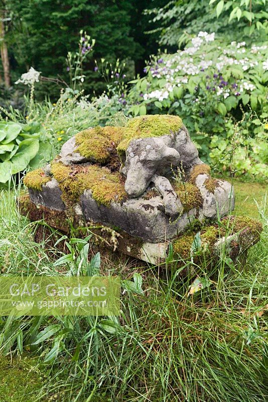 Moss covered pet dog memorial statue - July, Craigieburn, Moffat, Scotland