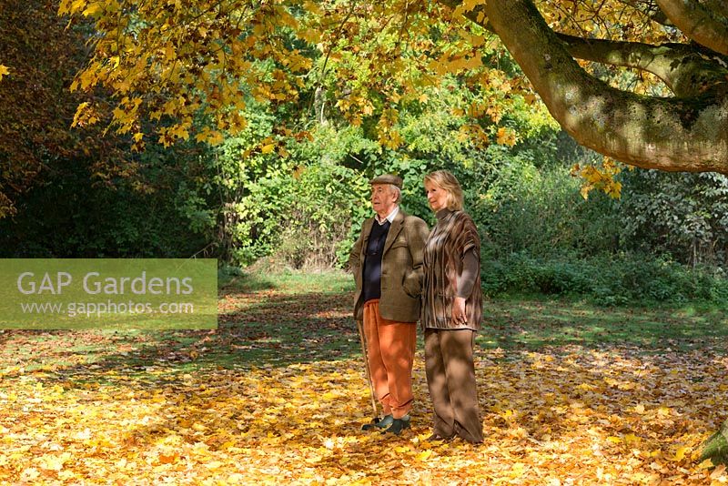 The late Iain Grahame with his wife, Bunny Campione, walking beneath Acer cappadocicum 'Aureum'