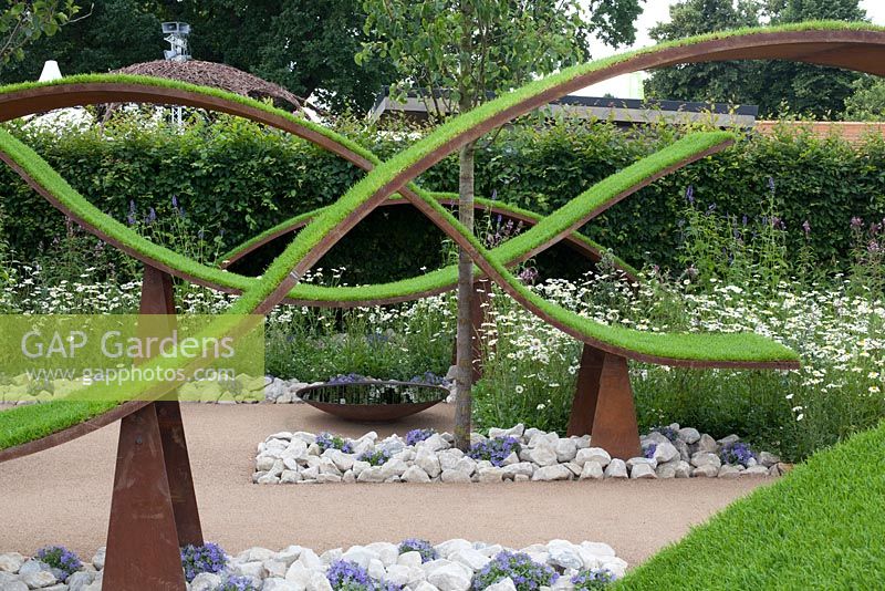 Floating waves of turf in The World Vision Garden at RHS Hampton Court Palace Flower Show 2016