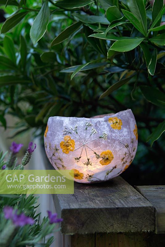 Finished paper lantern with tealight in garden