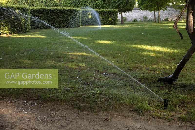 Automated lawn watering system. Chateau et Jardins du Rivau, Loire Valley, France