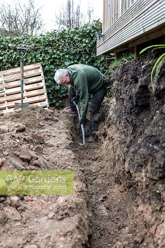 Urban garden makeover, Richmond with ACRES Gardens, digging trench for retaining wall foundations