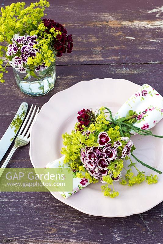 Summer table place setting with Dianthus barbartus - Sweet Williams and Alchemilla mollis