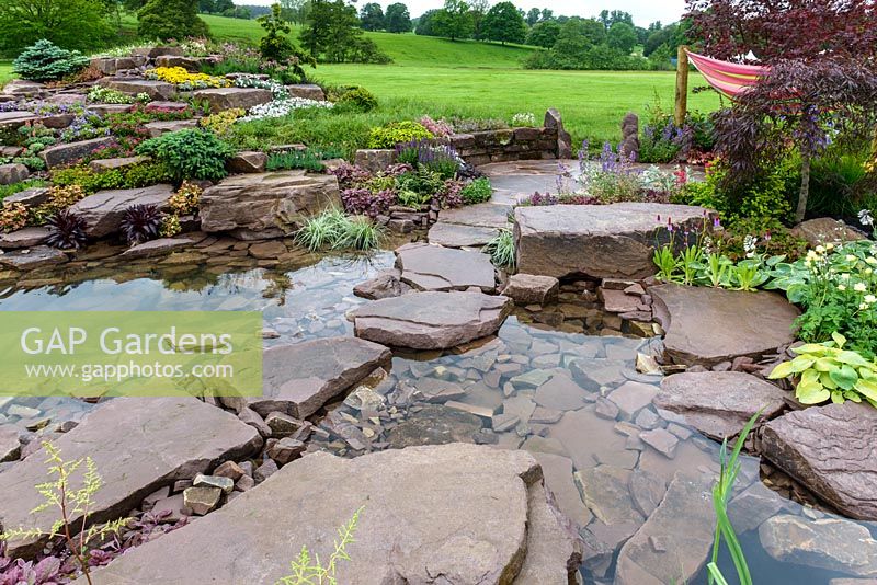Borrowed Landscape in Naturalistic Water Garden - Jackie Knight's Just Add Water - RHS Chatsworth Flower Show 2017  Designer: Jackie Sutton - Built and sponsored by Jackie Knight Landscapes
