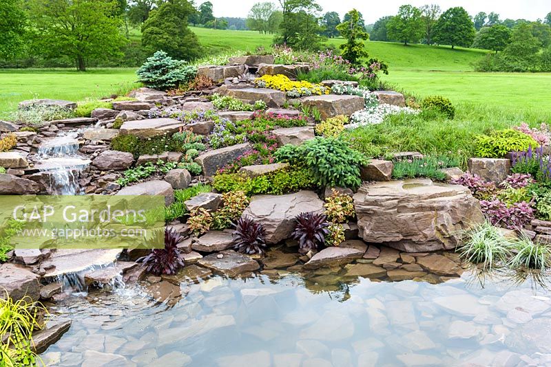 Borrowed Landscape in Naturalistic Water Garden - Jackie Knight's Just Add Water - RHS Chatsworth Flower Show 2017. Designer: Jackie Sutton - Built and sponsored by Jackie Knight Landscapes