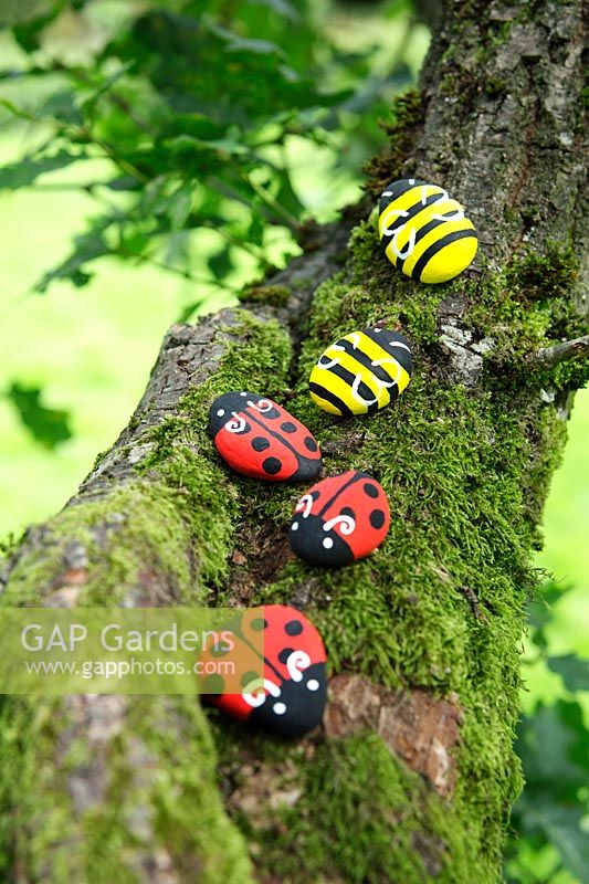 Garden craft making painted Bumble bees and Ladybirds with stones.  