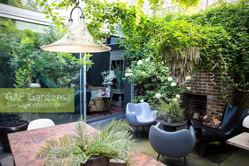 Outside lounge area with large light hanging. Hackney, London

