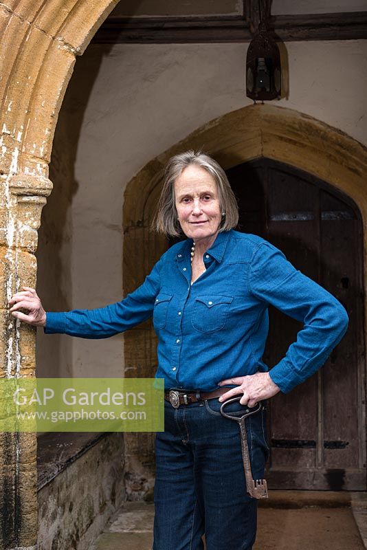 Mary-Anne Robb, owner of Cothay Manor holding the original key to the front door behind