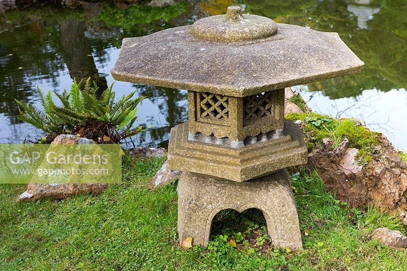 Stone lantern next to the Main Pond, Japanese Tea Garden at Golden Gate Park, San Francisco, California.
