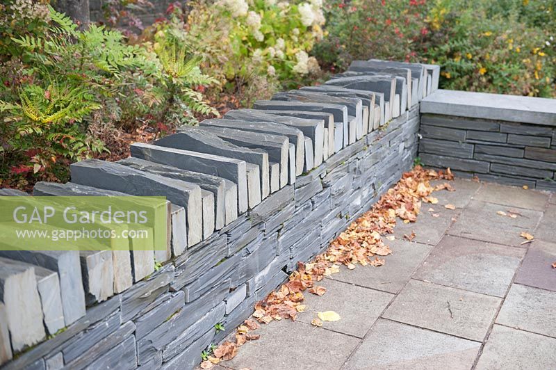 Local slate used in making walls in public spaces. Blaenau Ffestiniog Gwynedd Wales