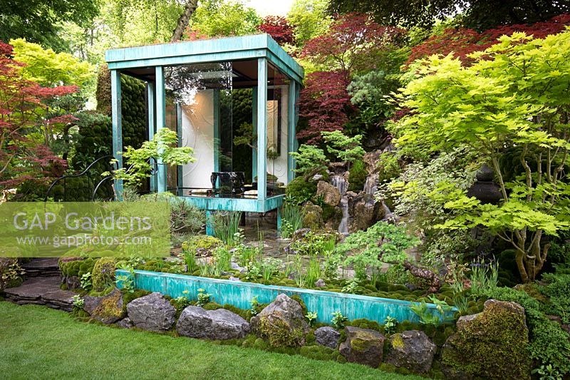 Gosho No Niwa No Wall, No War. Japanese garden with copper clad glass structure and waterfall. RHS Chelsea Flower Show 2017