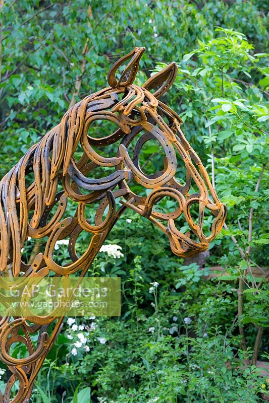The World Horse Welfare Garden, featuring horse sculpture by Tom Hill made of rusted horseshoes. RHS Chelsea Flower Show 2017
