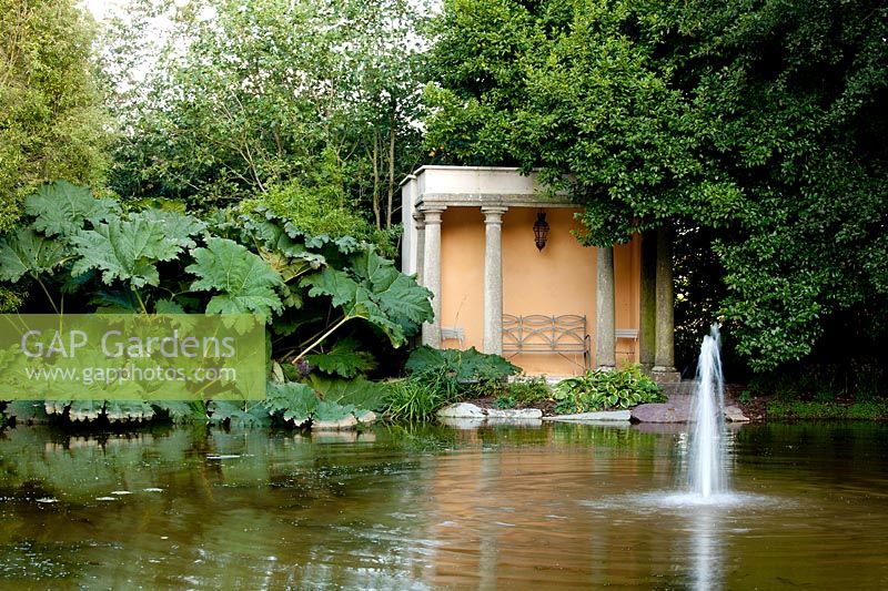 Classical Temple by pond in Pleasure Garden at Ballymaloe Cookery School and Garden. Ireland