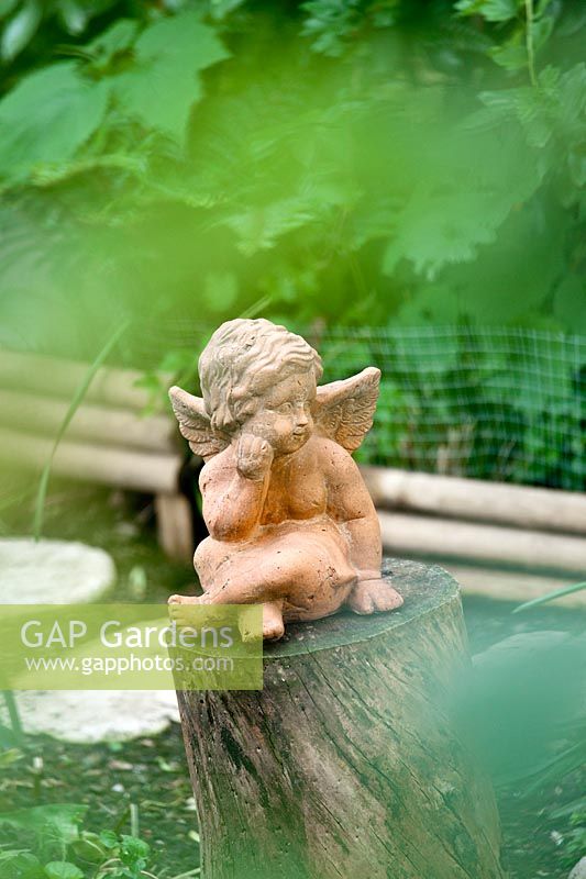 Terracotta cherub - Gaetano Zoccali garden. Milan. Italy