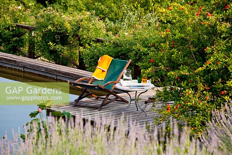 Deckchair by pond - Beretta Kastner architetti. Monza. Italy