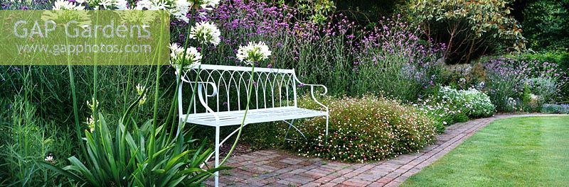 Mixed planting and bench seat, The Lost Gardens of Heligan, Cornwall