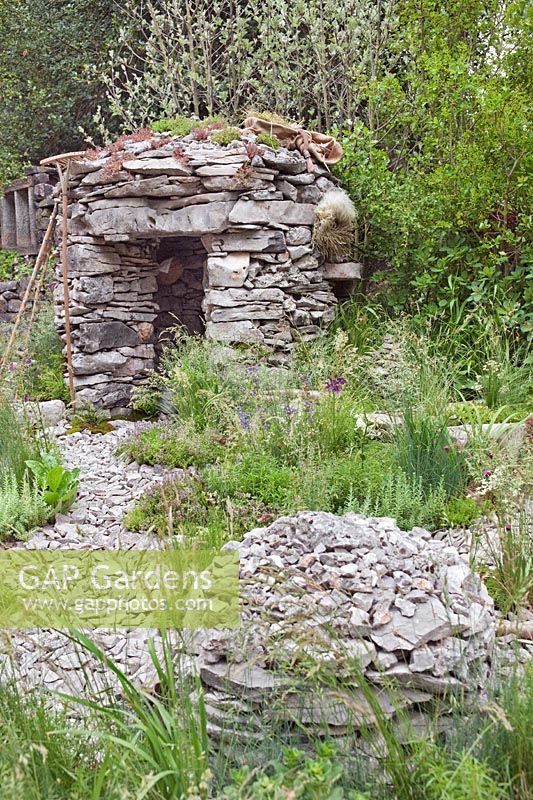 Limestone shepherds hut with dry meadow planting of Karst Region, Sustainable Development, RHS Chelsea 201. 