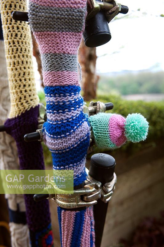 Knitted woollen protectors on scaffolding poles, Westland Magical Garden, RHS Chelsea 2012.