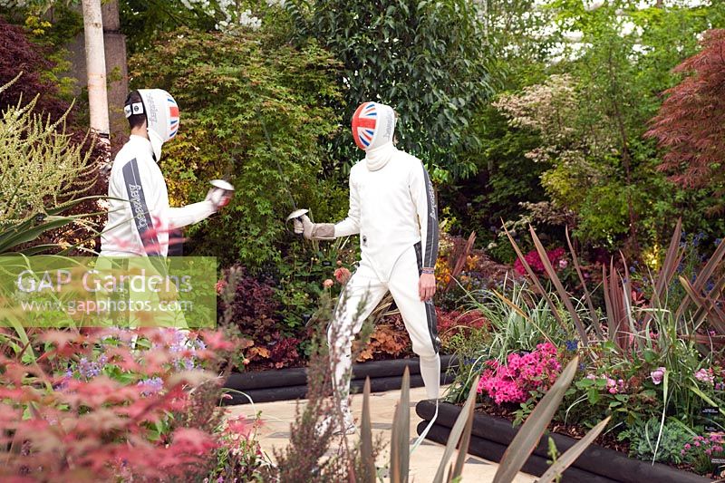 Two British Olympic Team fencers duel on pathway with borders, Duel and the Crown, RHS Chelsea 2012.