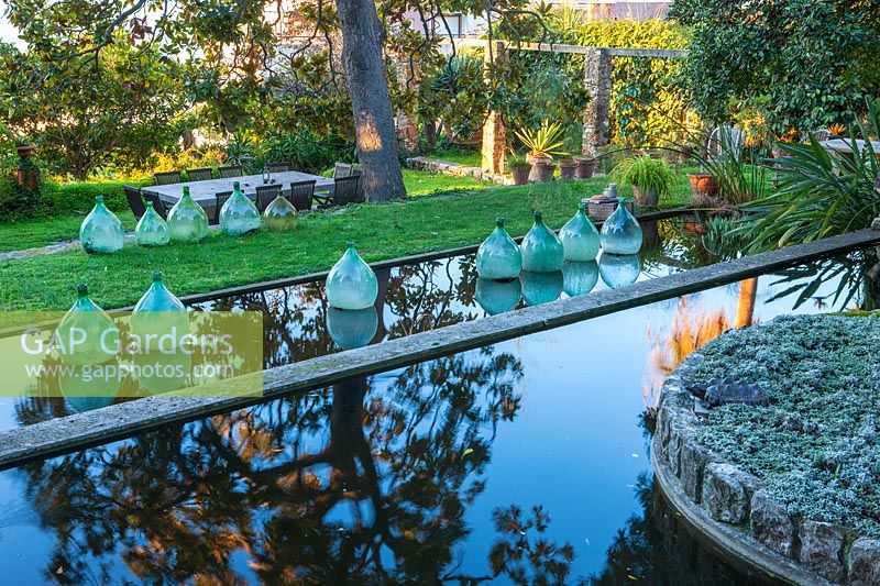 Terraced pools with glass bottles, Clos du Peyronnet, Menton, France.