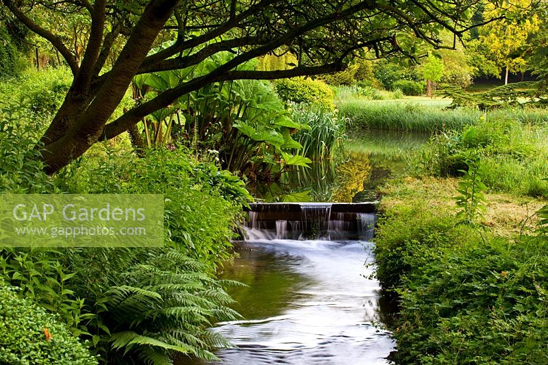 Stream and weir at Little Ponton Hall, Lincolnshire, June.