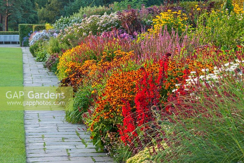 The famous double mixed border in summer stretching 128 metres down the hill - RHS garden, Wisley