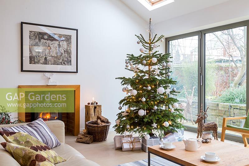 White colour themed Christmas tree in living room