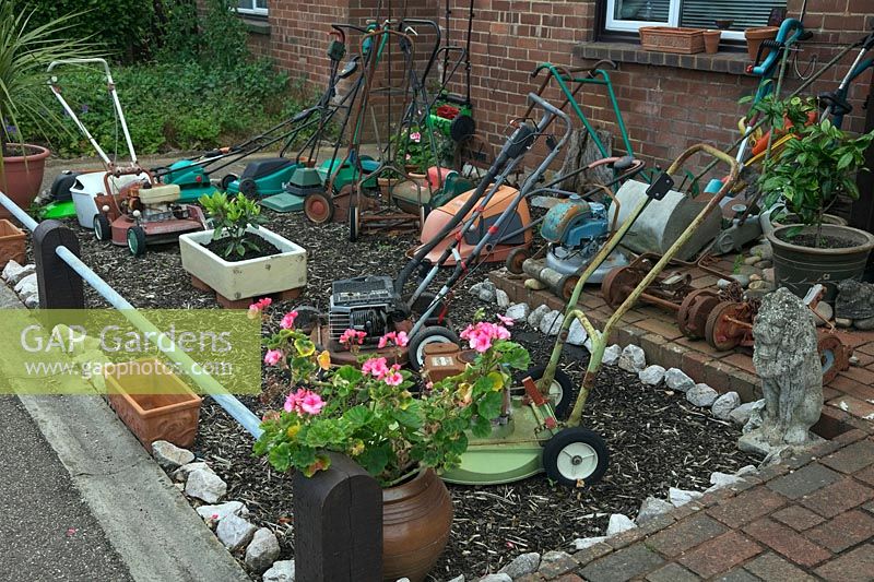 Front garden display of old lawnmowers, St Thomas, Exeter