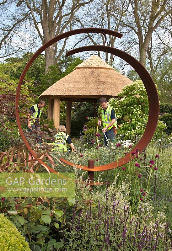 RHS Chelsea Flower Show. Build up - team creating the garden. The M and G Centenary Garden 'Windows Through Time'.