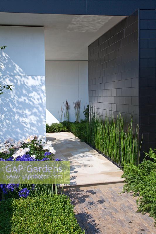 Contemporary garden with rectangular black and white pavilion RHS Hampton Court Show