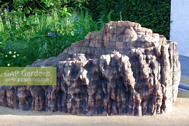 Cedar wood sculpture by Ursula von Rydingsvard. The Laurent-Perrier Garden Designer: Luciano Giubbilei RHS Chelsea Flower Show