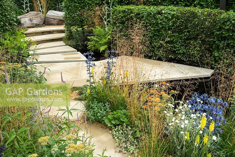 The RHS Watch This Space Garden at the RHS Hampton Court Flower Show 2017. Designer: Andy Sturgeon. A series of interconnecting gardens re-using and 