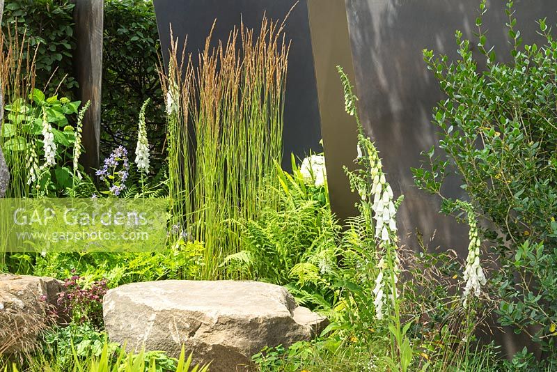 The RHS Watch This Space Garden at the RHS Hampton Court Flower Show 2017. Designer: Andy Sturgeon. A series of interconnecting gardens re-using and 