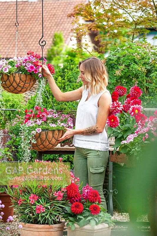 Young woman in the garden center