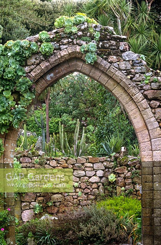 Stone archway to ruined Abbey at Abbey Gardens Tresco Scilly Isles UK