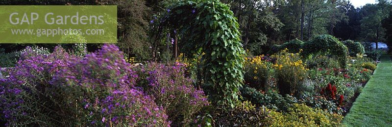 Arches of climbers or vines in Cut Flower & Vegetable Garden at Chanticleer Garden, Wayne, Pennsylvania, USA