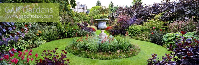 Circular perennial garden with urn at Red Garden at Crathes Castle, Aberdeenshire, Scotland. NTS property