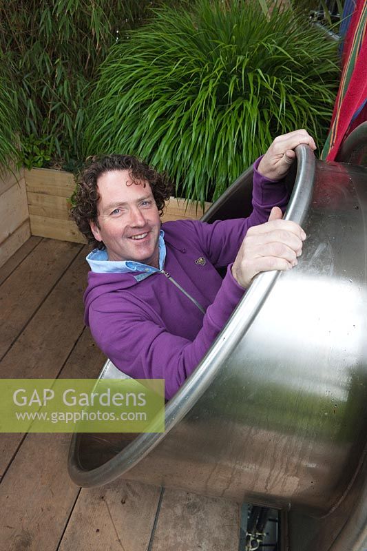 Diarmuid Gavin entering the stainless steel shute. The Westland Magical Garden designed by Diarmuid Gavin Silver-Gilt Medal