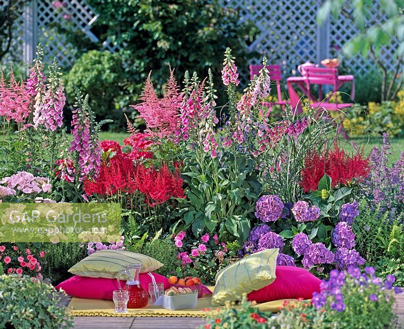 Image of Astilbes and foxgloves