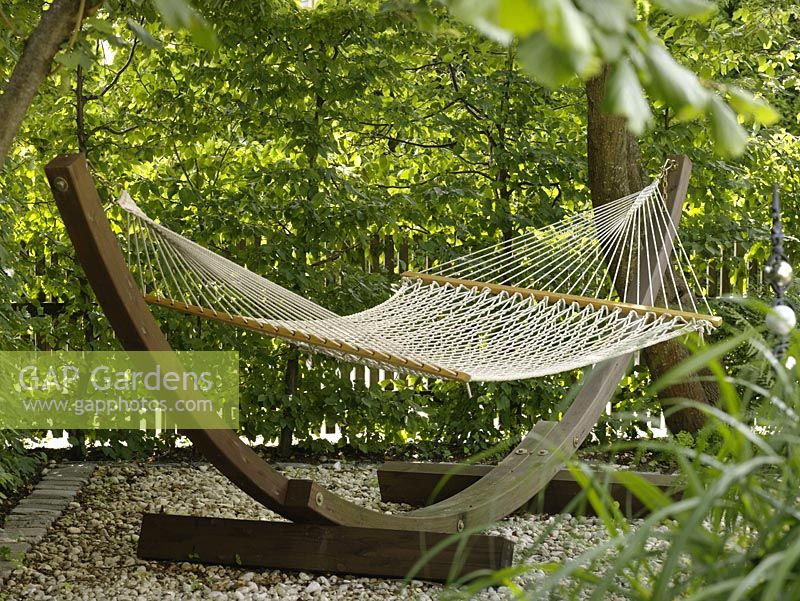 Hammock with wooden frame on gravel