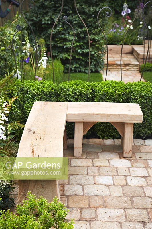 Wooden garden bench on the patio